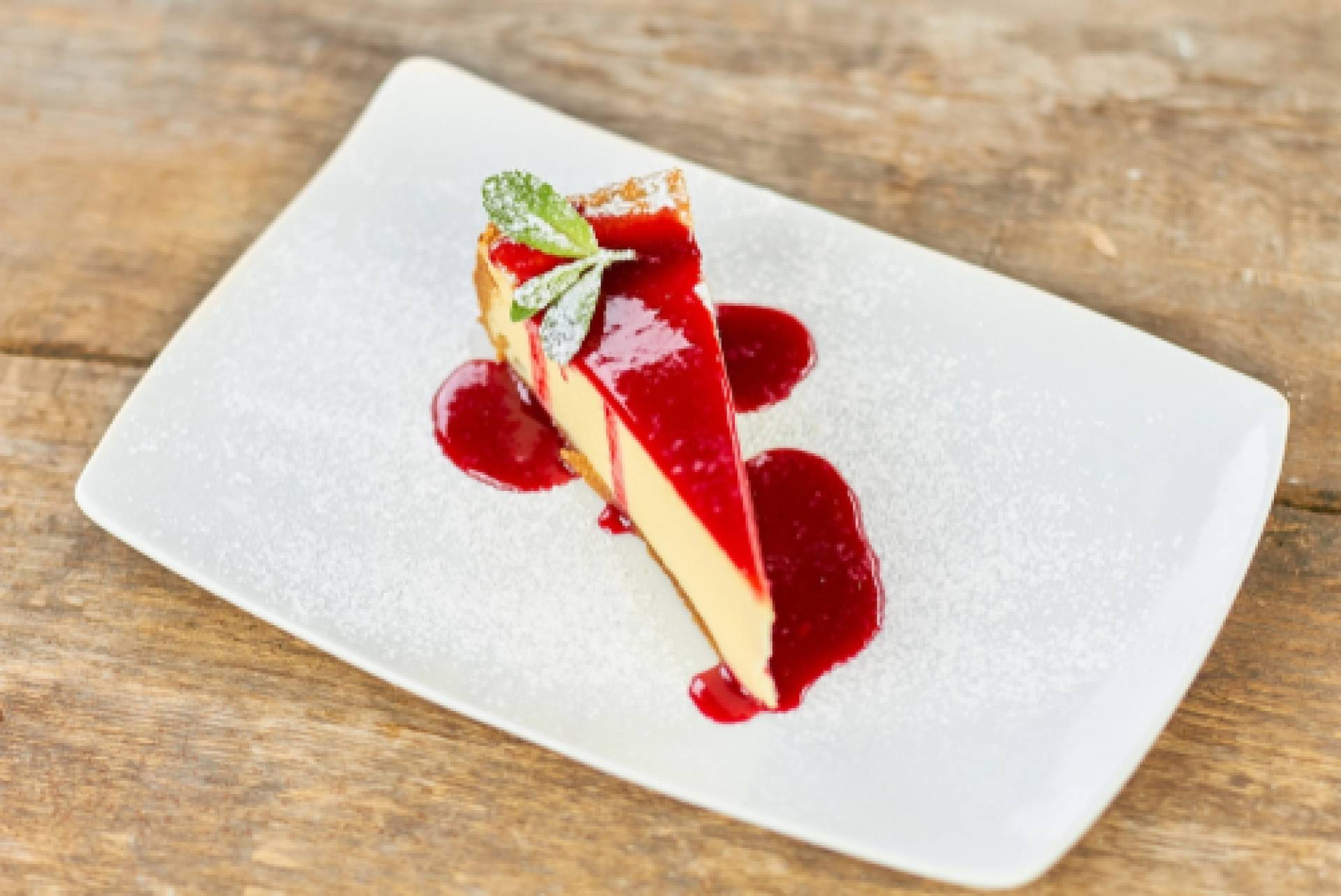 Limnocello Cheesecake with Raspberry Coulis
